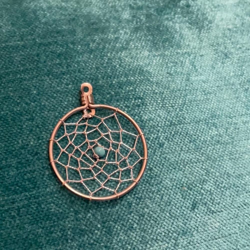 Pendant: silver dreamcatcher with turquoise bead at centre
